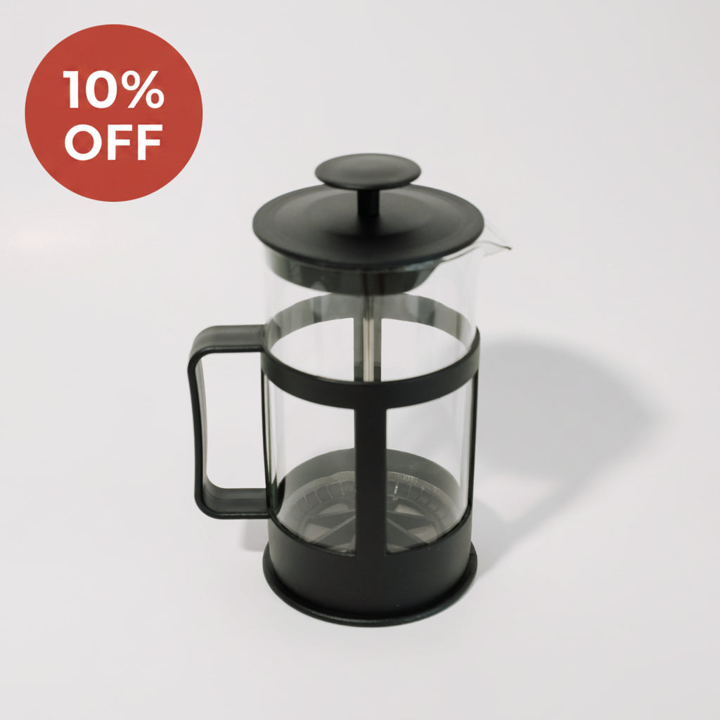 Black French press coffee maker on a white background