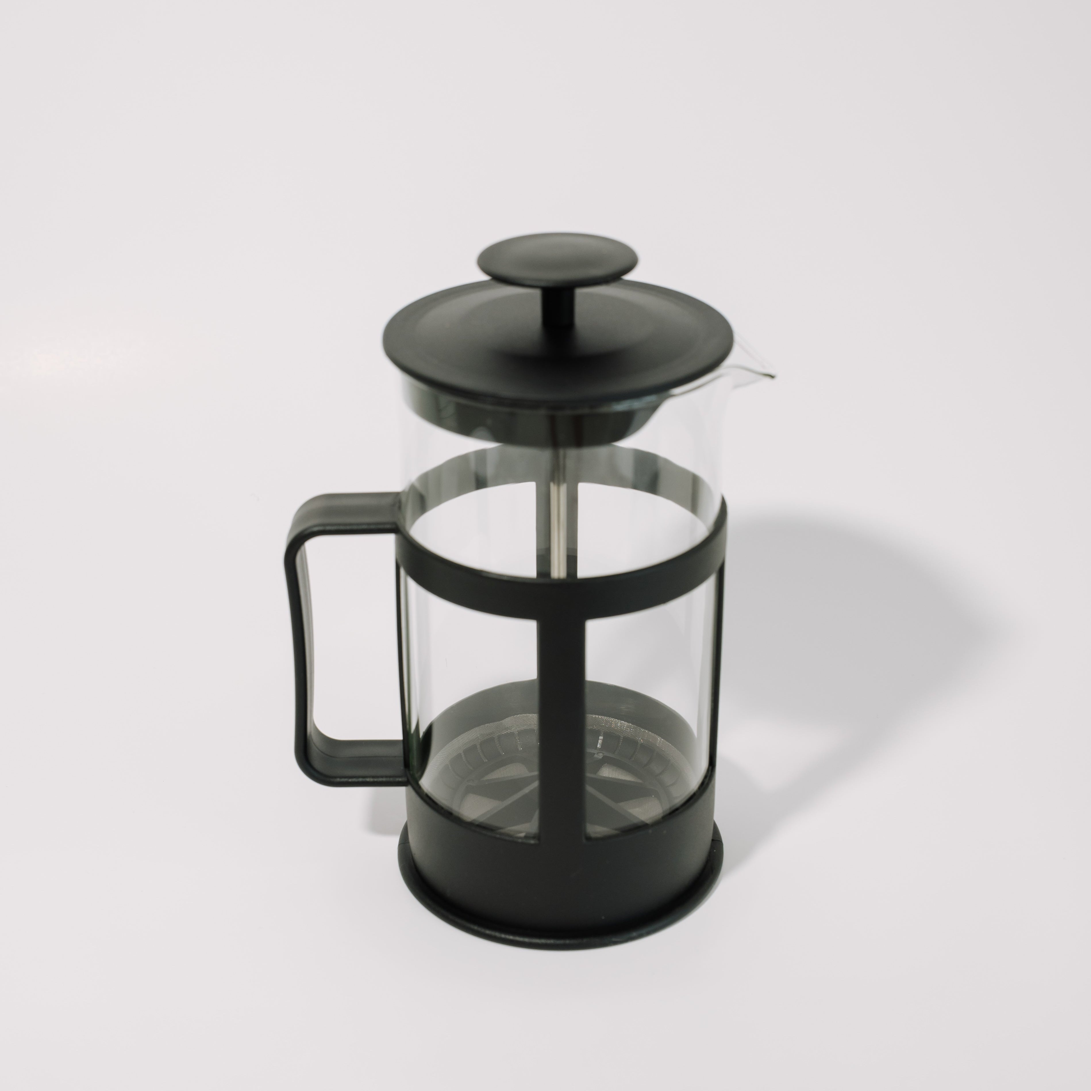 Black French press coffee maker on a white background